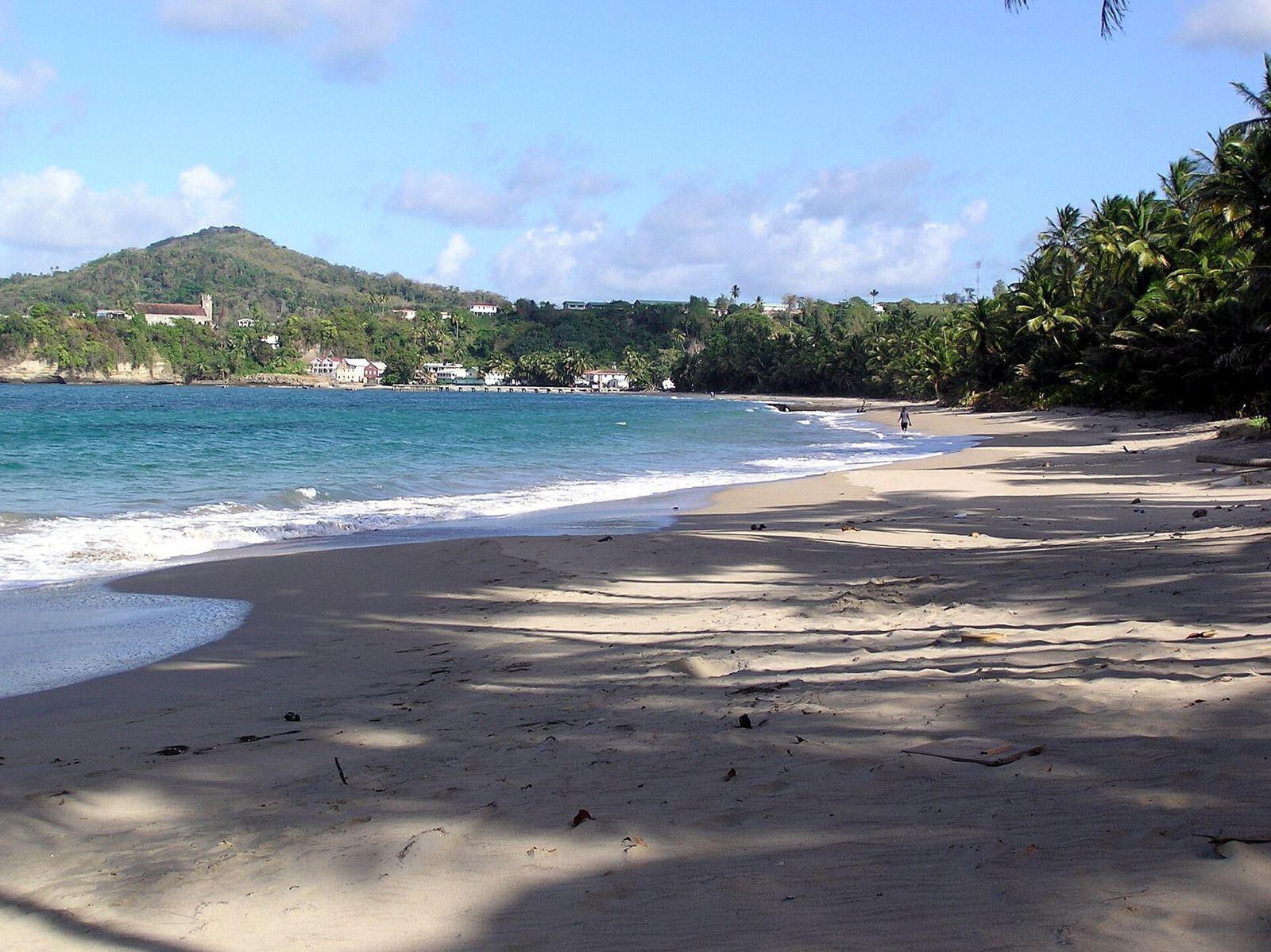A long beach and green hills at Sauteurs Bay in the north of Grenada